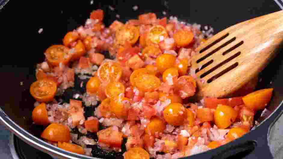 Five Cheese Ziti Al Forno Recipe: Stir in the cherry and Roma tomatoes and turn the heat up to high.