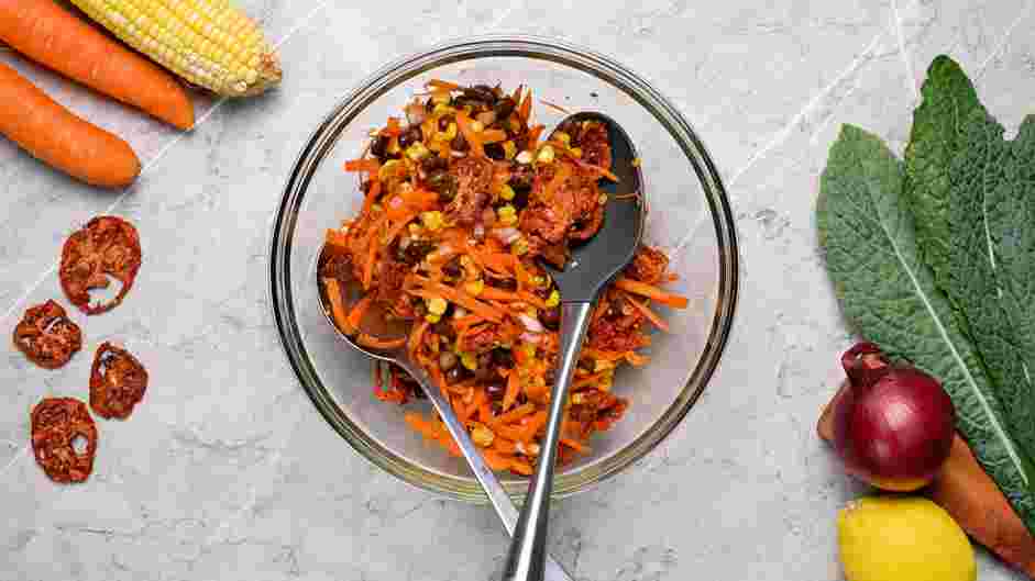 Raw Wraps Recipe: In a second bowl, add the sundried tomatoes, black beans, shredded carrots, corn kernels, chopped red onions, minced garlic cloves, thyme leaves and cayenne pepper.