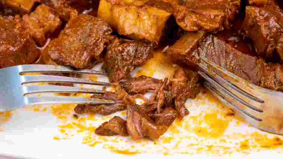 Short Rib Ragu Recipe: Shred the short rib meat, discarding the bones.