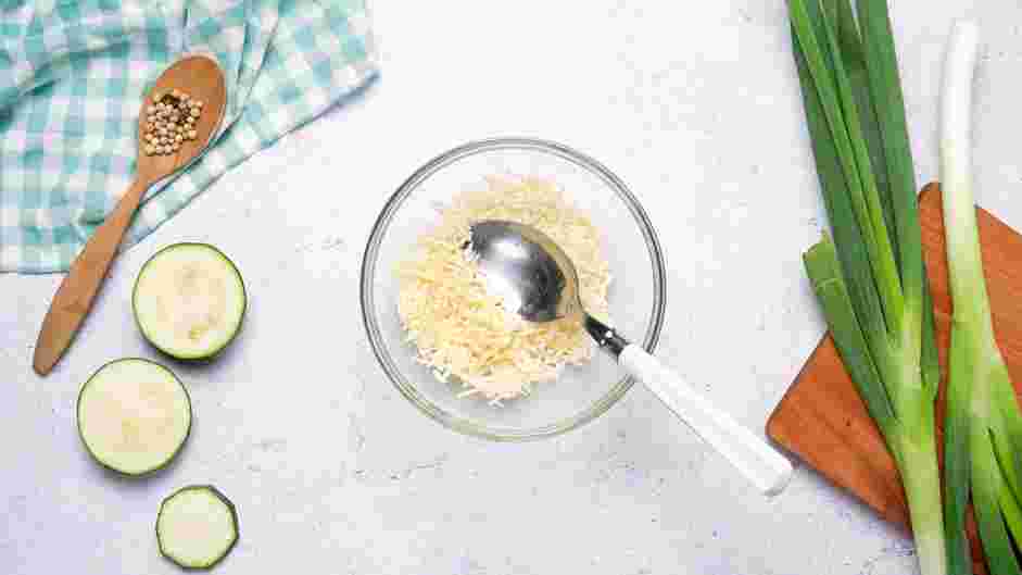 Zucchini Bites with Paprika Greek Yogurt Recipe:
Prepare the cheese by combining the Parmigiano Reggiano and extra-sharp cheddar cheese in a bowl.