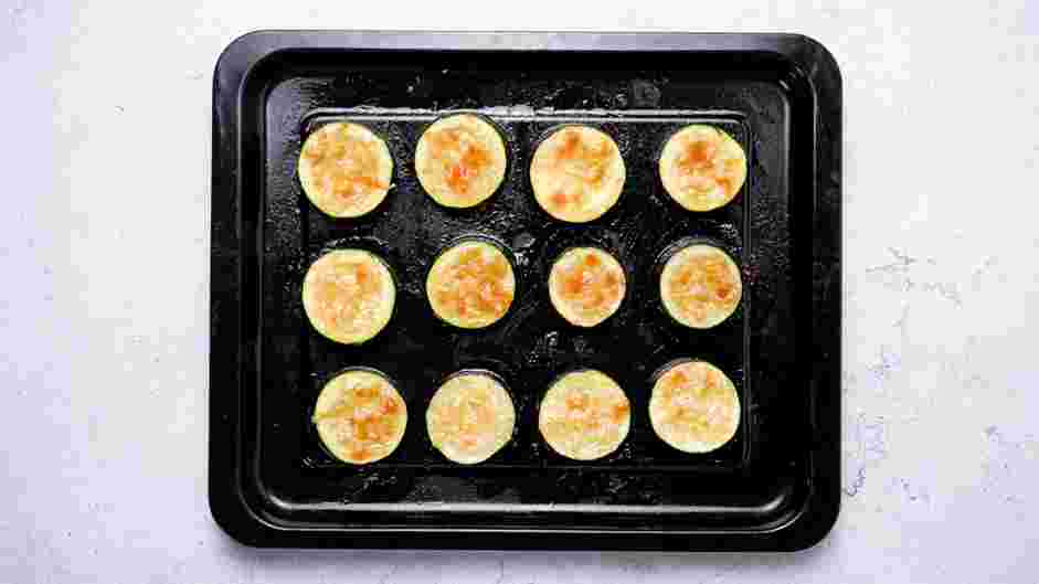 Zucchini Bites with Paprika Greek Yogurt Recipe:
Broil the zucchini for 3 minutes or until the cheese is melted and golden in color.