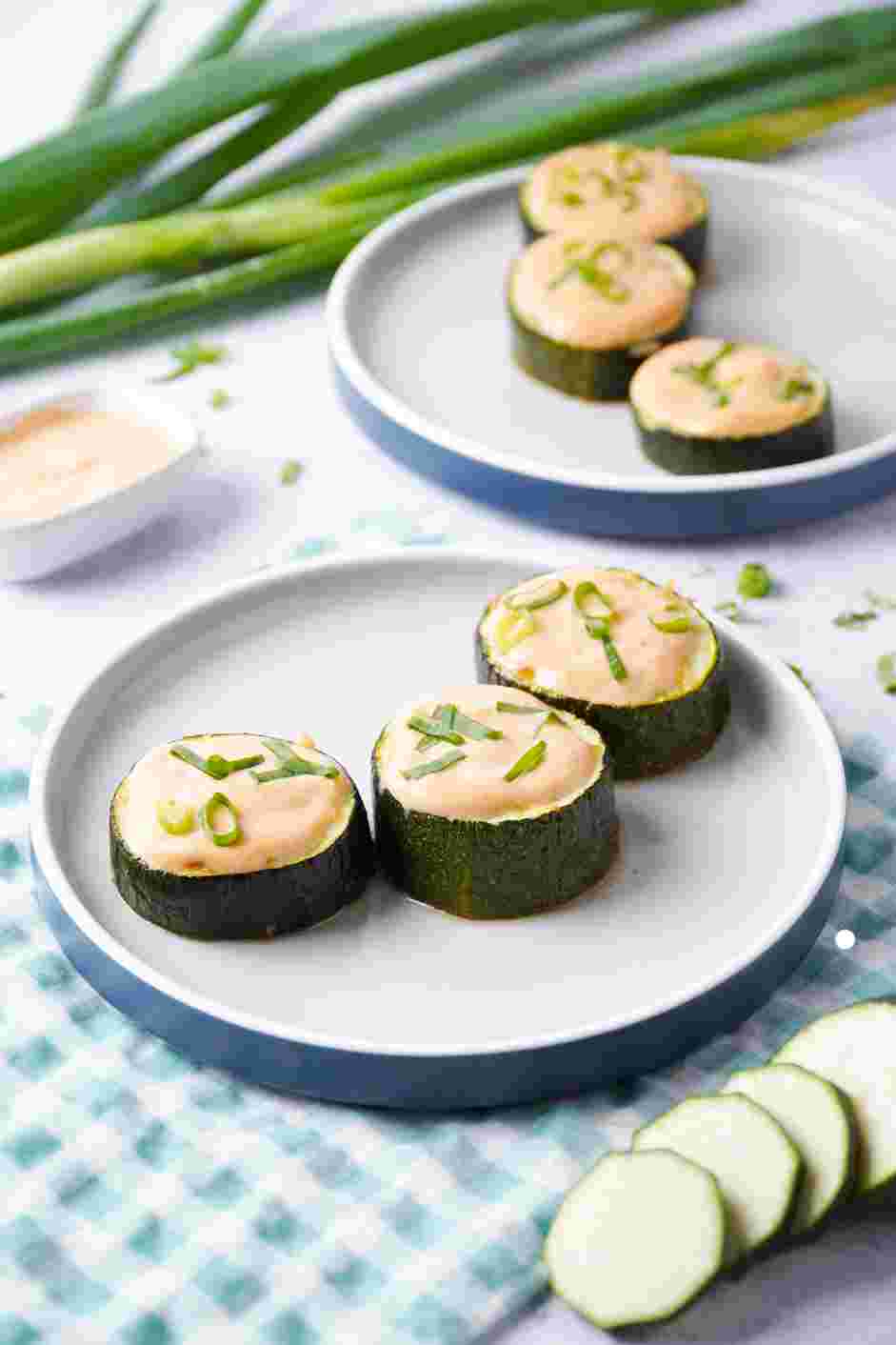 Zucchini Bites with Paprika Greek Yogurt Recipe: Top each zucchini bite with &frac12; tablespoon of paprika Greek yogurt and garnish with thinly sliced scallions.