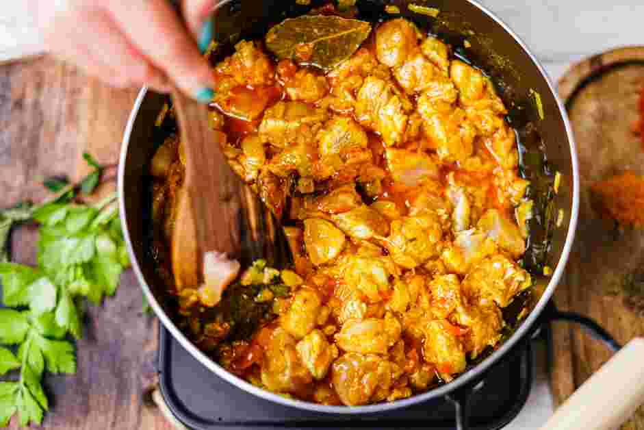 Andhra Chicken Curry Recipe: Add the chopped chicken, making sure both sides of the chicken are well covered with the mixture.