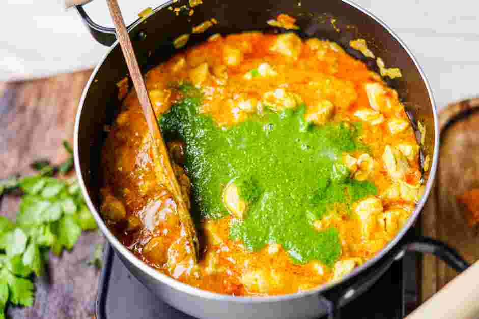 Andhra Chicken Curry Recipe: Stir in the reserved green paste and coconut milk.