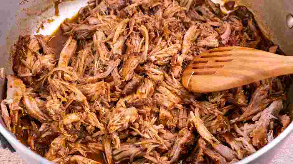 Dr Pepper Pulled Pork Recipe: Add the shredded pork back into the cooking liquid.