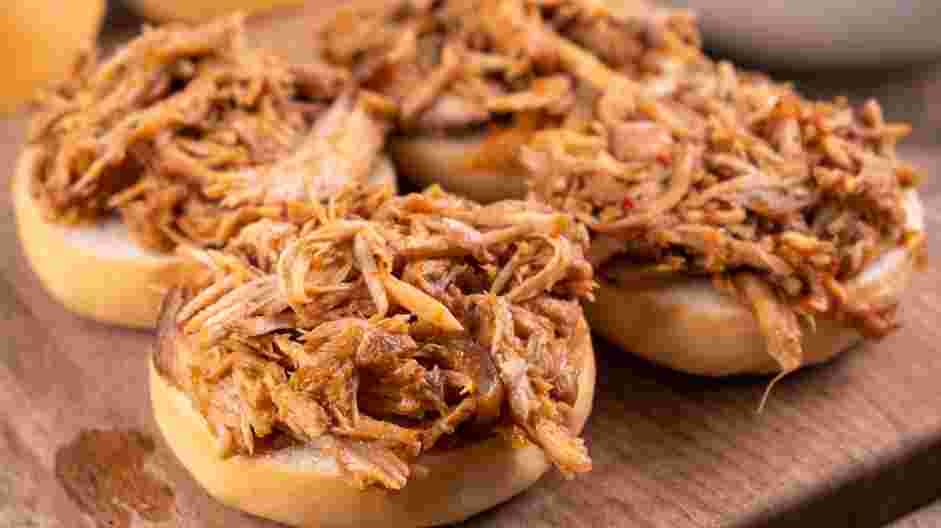 Pulled Pork Sliders Recipe: Place a generous mound of pulled pork on the bottom half of the slider buns.