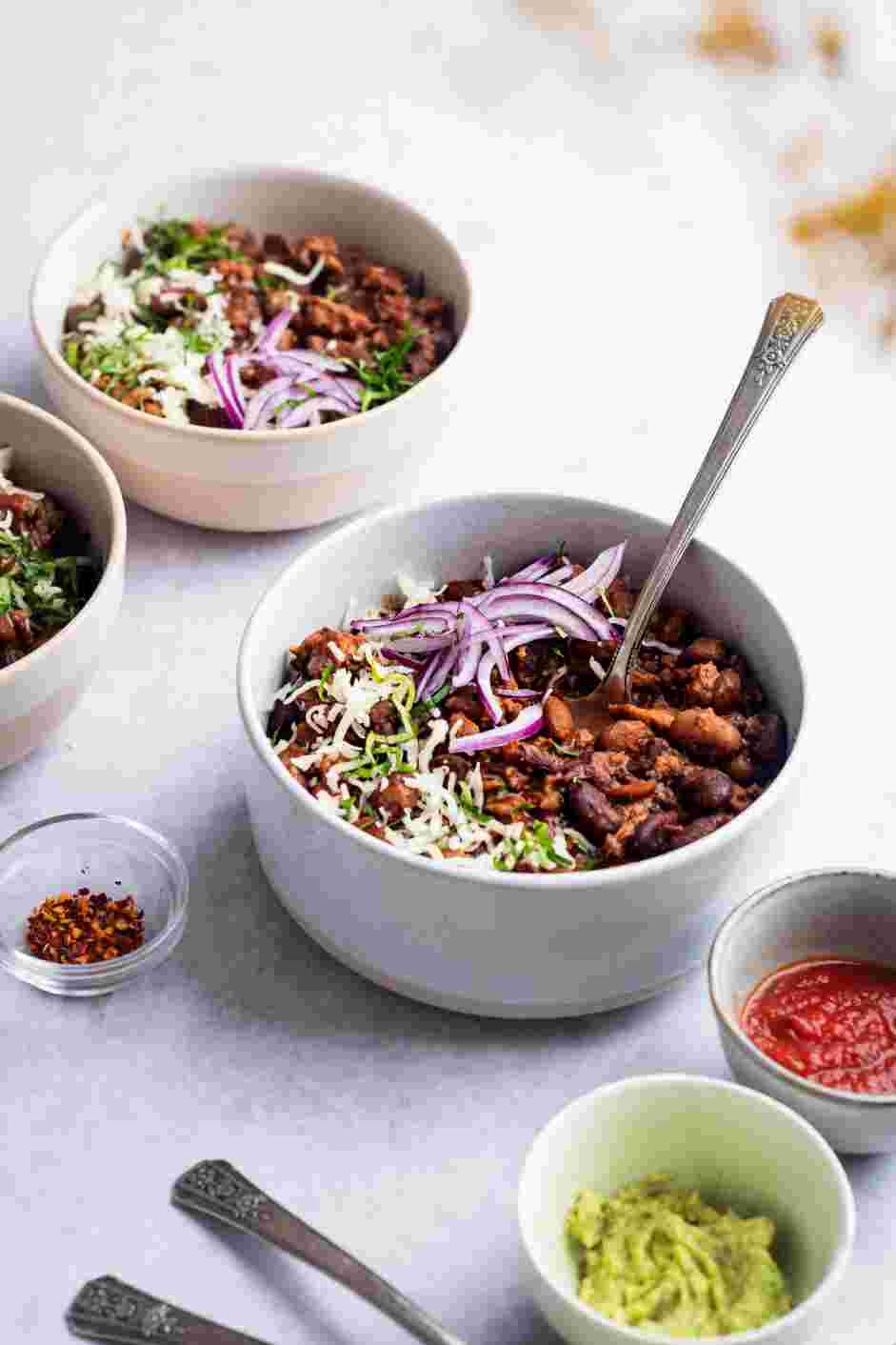 Stovetop Chili Recipe: Serve the stovetop chili with chopped onions, cilantro and shredded cheese.