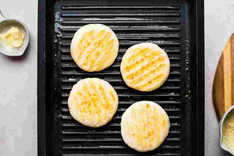 Arepa con Queso (Cheese Arepa) Recipe: Heat a griddle on medium-low heat.