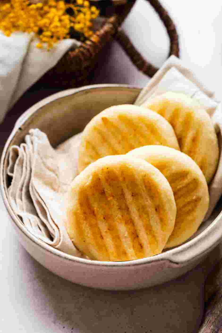 Arepa con Queso (Cheese Arepa) Recipe: Arepa con queso can be split in half and stuffed or eaten on its own.