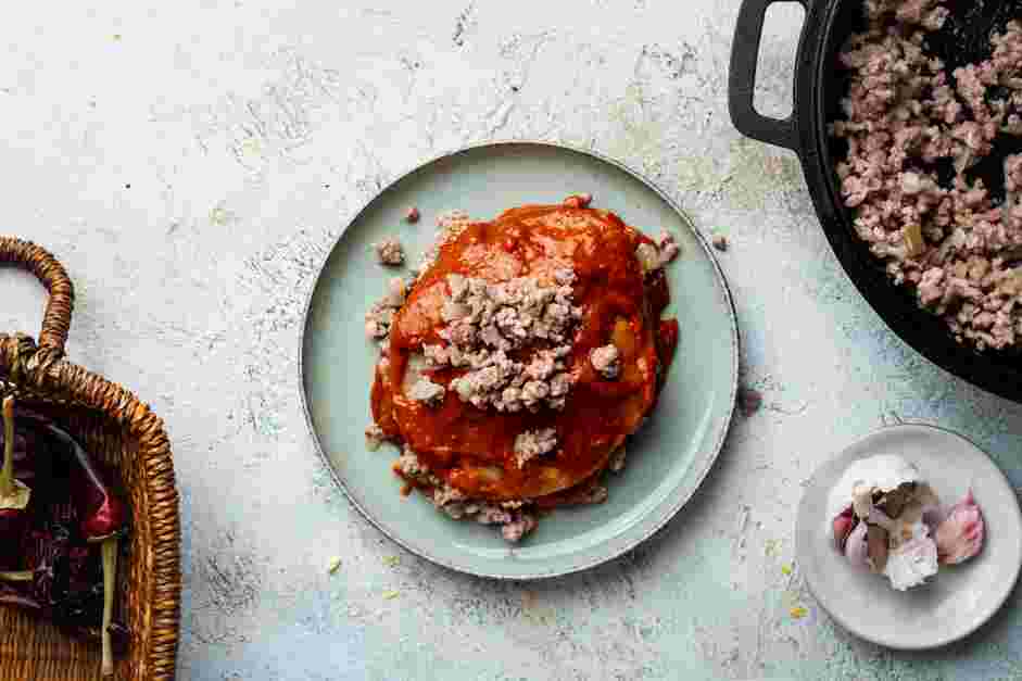 Enchiladas Rojas Recipe: Top with the reserved carne molida.