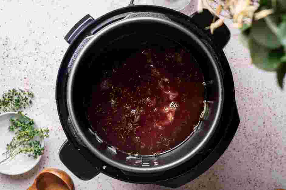 Instant Pot French Onion Soup Recipe: Stir in the salt, thyme, red wine and beef broth to the pot.