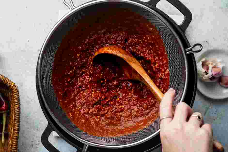 Enchiladas Rojas Recipe: Strain the salsa roja through a fine-mesh strainer into the same stockpot&nbsp;