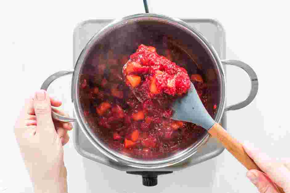 Apple Cranberry Sauce Recipe: Cook, stirring occasionally, until the cranberries pop and become jammy and the apples soften, about 10 minutes.