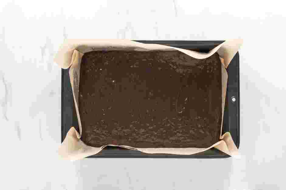 Peppermint Brownies Recipe: Evenly spread the brownie batter in the prepared pan.