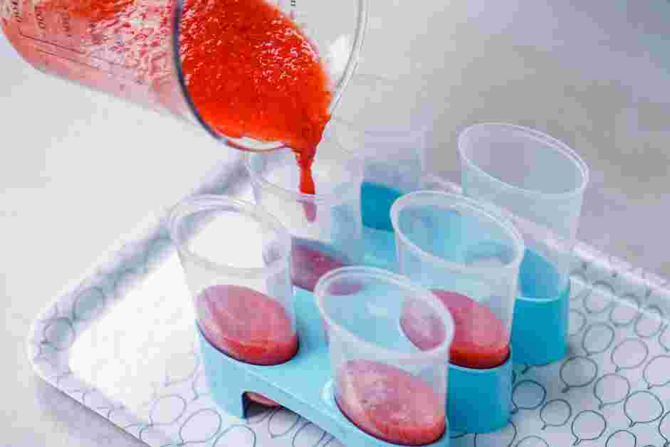 Red White and Blue Popsicles Recipe: 
Fill each popsicle mold ⅓ of the way with the strawberry mixture.