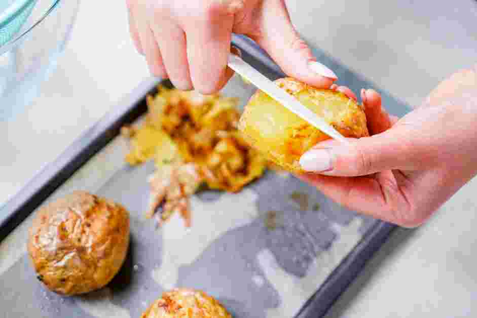 Potato Gnocchi with Butter and Herbs Recipe: Once the potatoes are done, use a paring knife to immediately peel the skin.