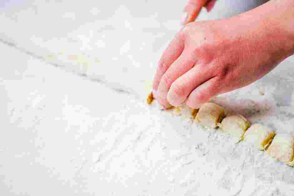 Potato Gnocchi with Butter and Herbs Recipe: Use a floured bench scraper or butter knife to cut each rope into &frac12; inch pieces.