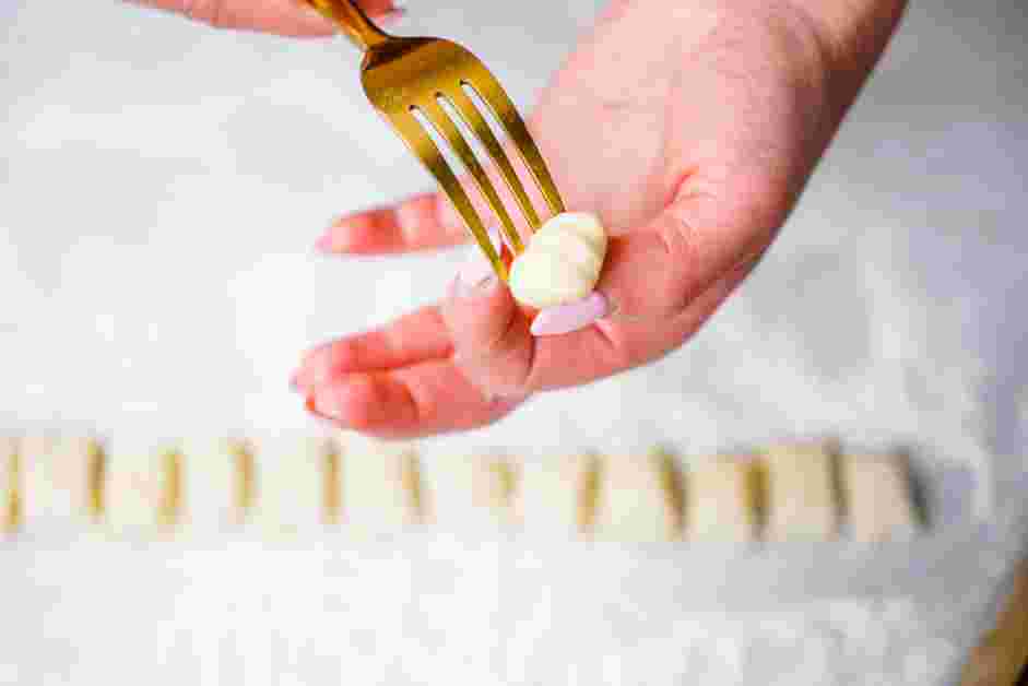 Potato Gnocchi with Butter and Herbs Recipe: Roll each piece into little balls and then run the back of a fork across each ball to create the grooves.