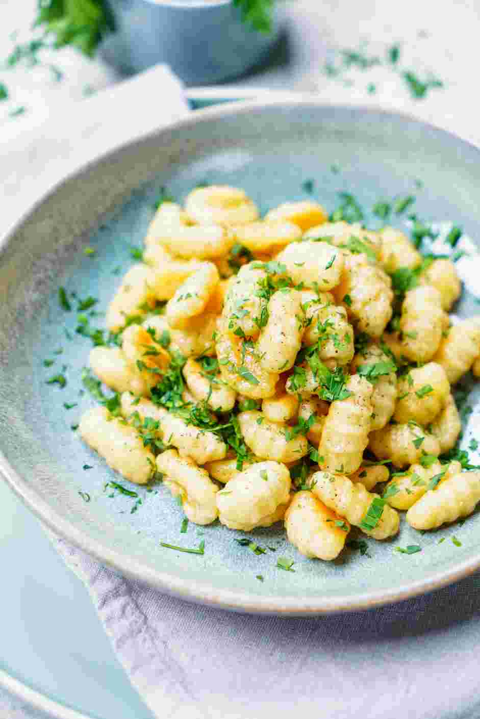 Potato Gnocchi with Butter and Herbs Recipe: Garnish with minced parsley for color.