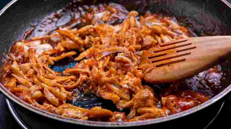 BBQ Chicken Sandwich with Napa Slaw Recipe: Stir in the shredded chicken and keep warm.