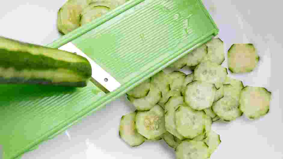 Japanese Cucumber Salad Recipe: Slice the cucumber into thin rounds and place them in a bowl.