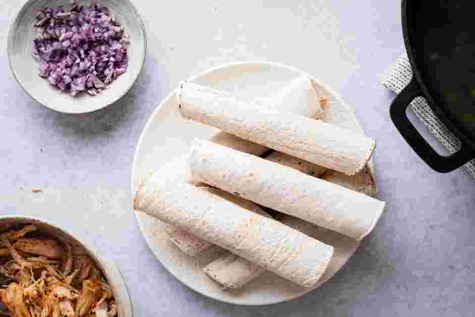 Chicken Flautas Recipe: Fold the flap closest to you over and tuck under the chicken.