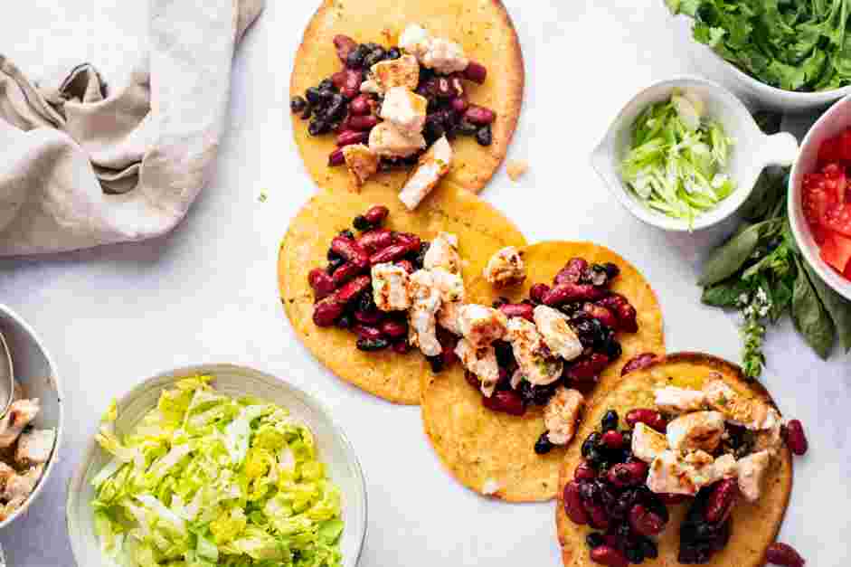 Chicken Tostadas Recipe: Assemble the chicken tostadas.