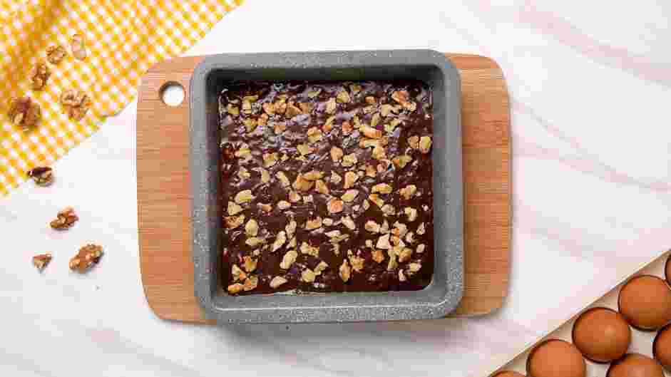 Walnut Brownies Recipe: Spread the batter evenly into the greased baking pan.