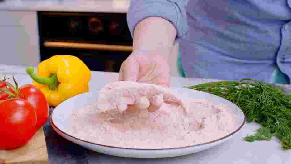 Buttermilk Chicken Tenders Recipe: Remove one piece of chicken at a time and dredge it in the flour.