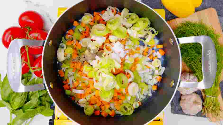 Garden Vegetable Soup with Pesto Recipe: Stir in the onions, leeks, carrots and celery.