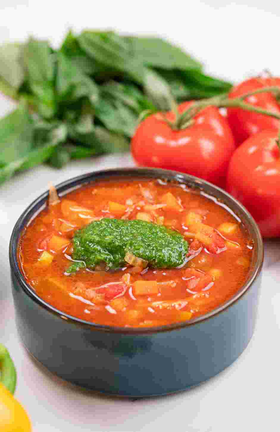 Garden Vegetable Soup with Pesto Recipe: Ladle the soup into bowls and serve with a drizzle of the fresh pesto over the top.