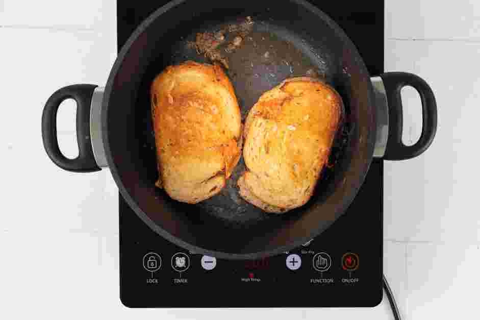 Grilled Cheese and Tomato Soup Recipe: Once the cheese has melted, top each toast with the remaining slices of sourdough bread.