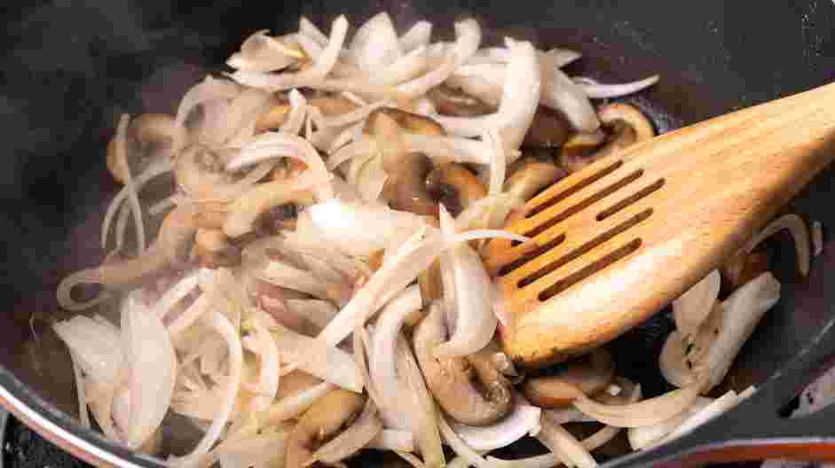 Mushroom Swiss Burger Recipe: Reduce the heat to medium and add the sliced onion, salt, pepper and Worcestershire sauce.