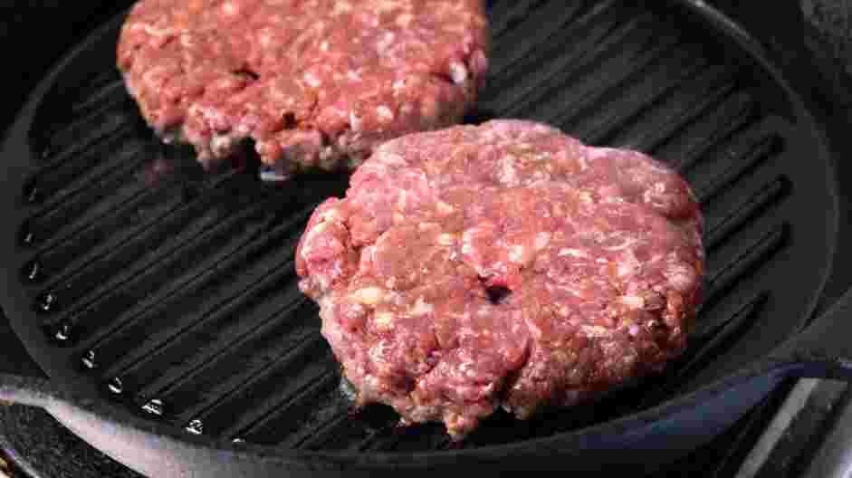 Mushroom Swiss Burger Recipe: Add the patties to the grill for 8 minutes on one side.