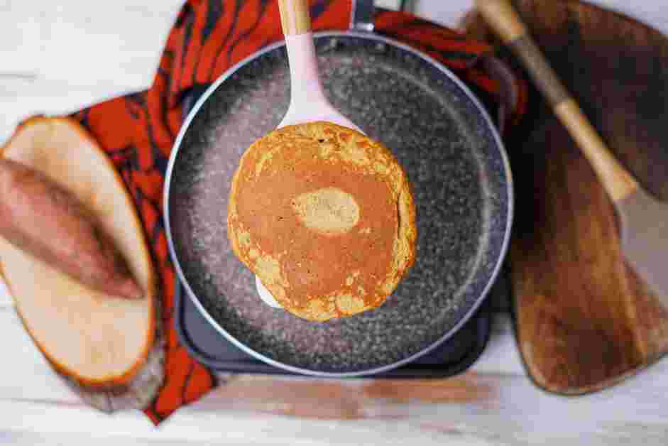 Sweet Potato Pancakes Recipe: Flip the pancakes and cook for another 2-3 minutes or until the bottoms are browned.