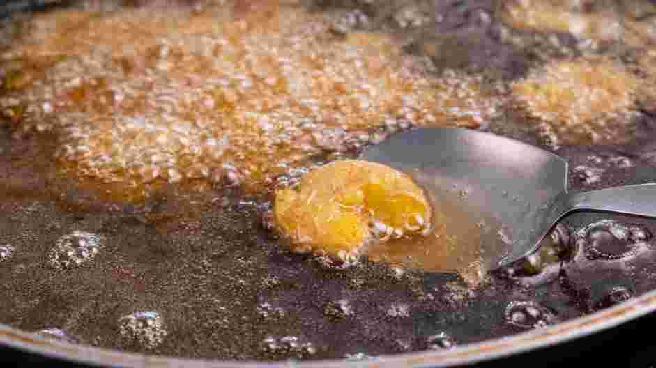 Deep Fried Potatoes (Sindhi Tuk Aloo) Recipe: Place the oil in a stockpot and heat the oil until hot.