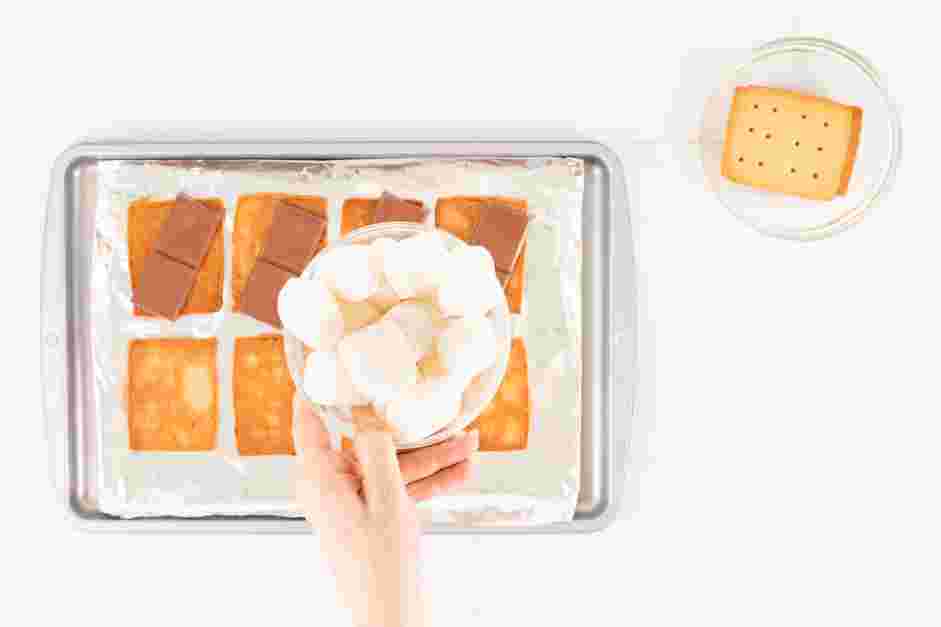 Smores in the Oven Recipe: Place one marshmallow on top of each piece of chocolate.