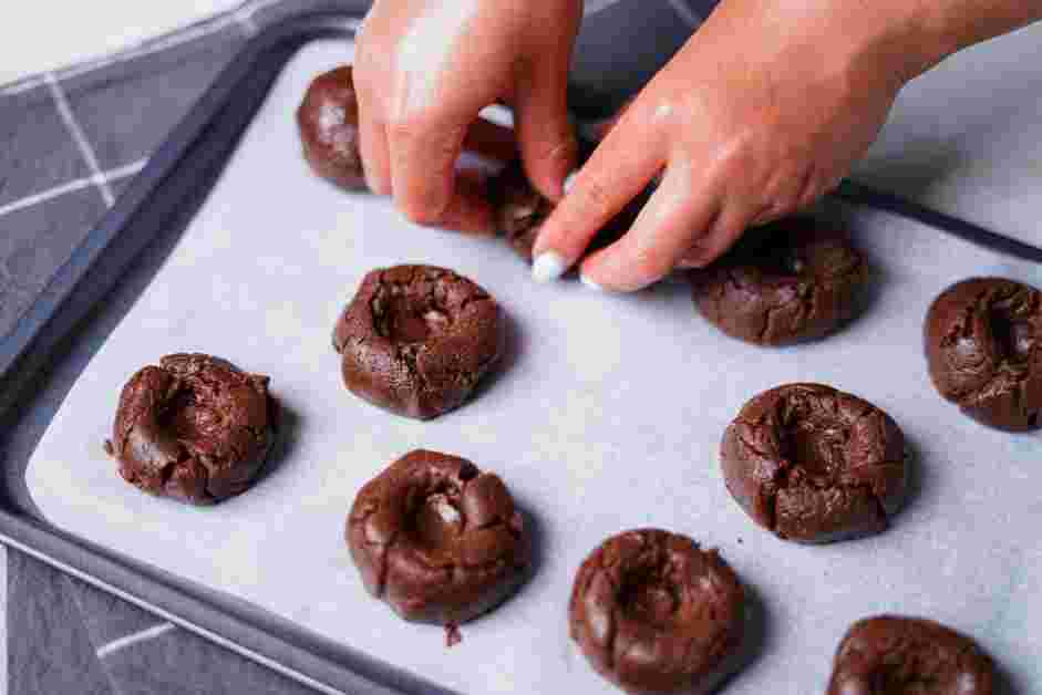 Nutella Cookies Recipe: Use a finger or the end of a wooden spoon to create a divot in the center of each cookie.