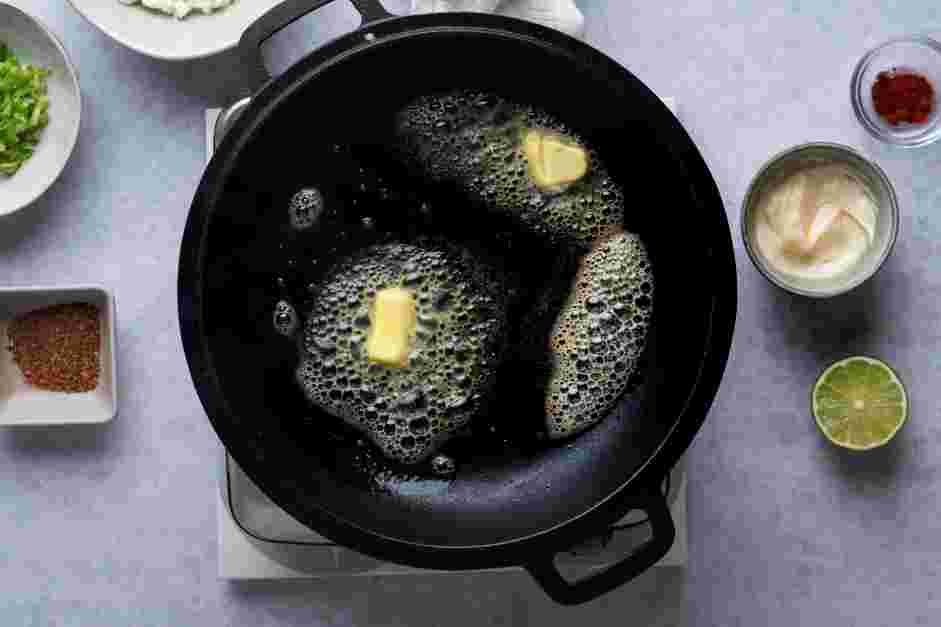 Street Corn Dip Recipe: In a cast-iron skillet over medium-high heat, add the butter and melt.