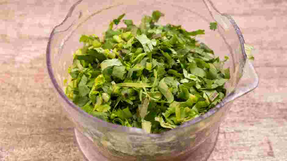 Carne en Su Jugo (Meat in its Juices) Recipe: Add the garlic cloves and the cilantro back to the food processor and blend until smooth.