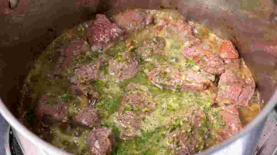 Carne en Su Jugo (Meat in its Juices) Recipe: Add the reserved tomatillo puree and the garlic cilantro sauce to the Dutch oven.