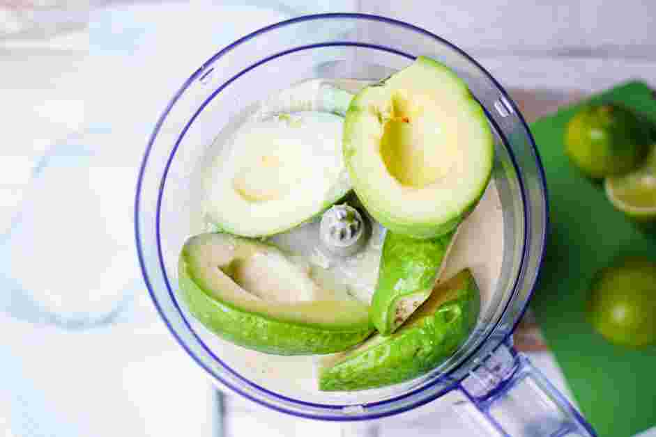 Avocado Ice Cream Recipe: In the bowl of a food processor or the jar of a blender, add the avocados, sweetened condensed milk, 3 tablespoons lime juice, vodka and salt.