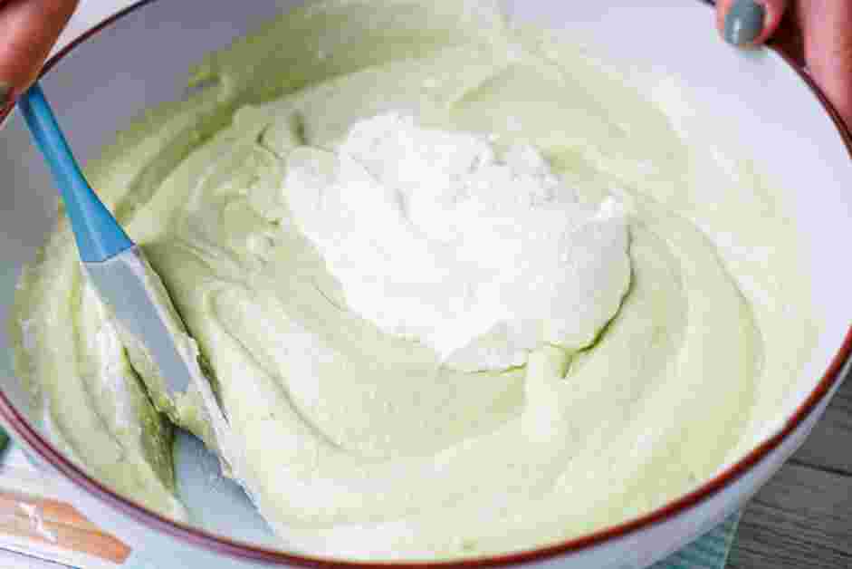 Avocado Ice Cream Recipe: Remove the plastic wrap and add one-third of the whipped cream to the condensed milk mixture and fold.