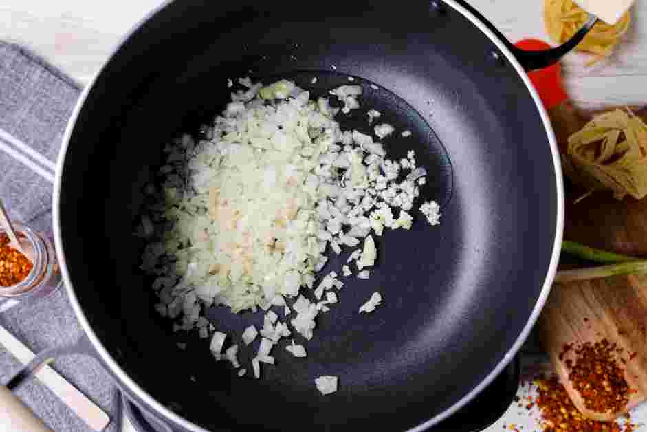 Spicy Marinara Sauce Recipe: In a one-quart pot over medium heat, add the canola oil, diced onions and garlic.