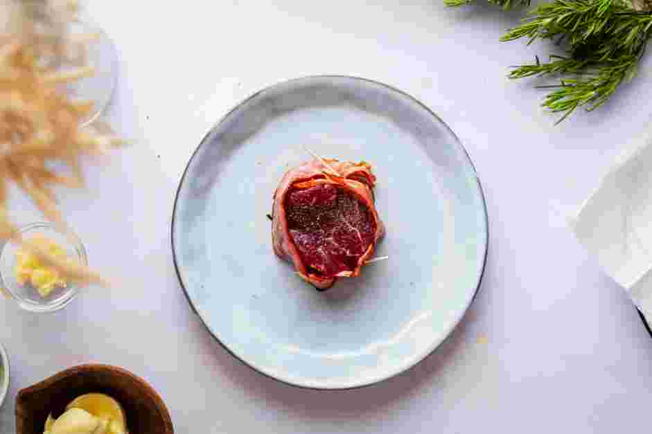 Bacon Wrapped Filet Mignon Recipe: Wrap the steaks completely with bacon, securing it with a piece of cotton twine or toothpicks.