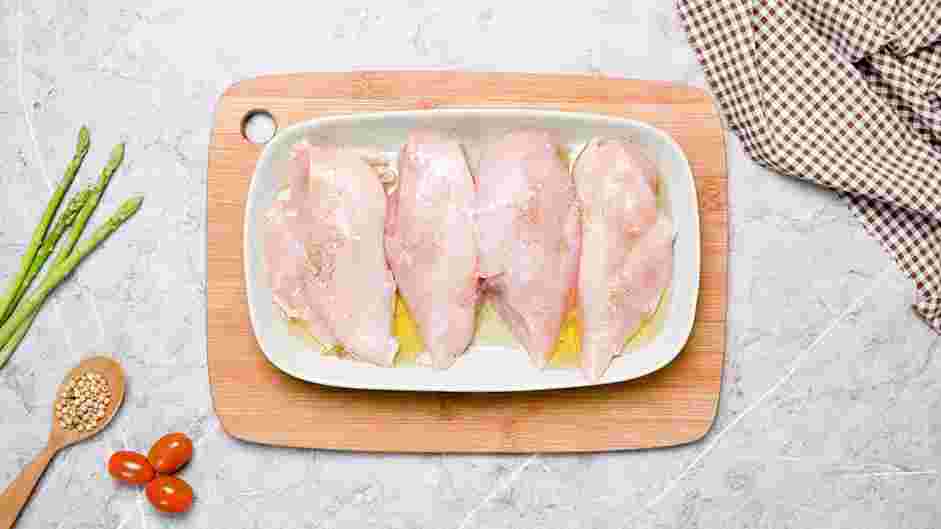 Asparagus Stuffed Chicken Recipe: Season the chicken breasts with four tablespoons of extra-virgin olive oil, salt and pepper.