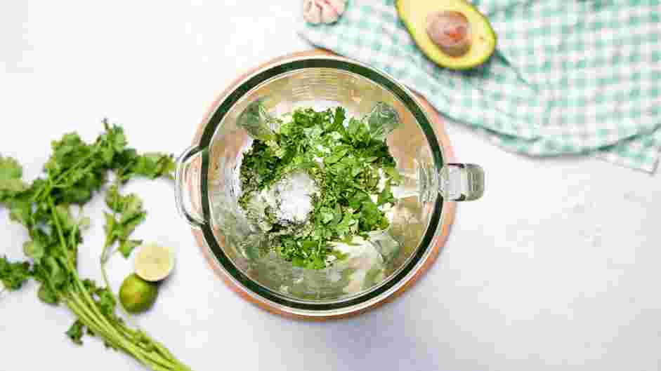 Avocado Crema Recipe: In the bowl of a food processor or a blender, add the avocados, garlic, Mexican crema, cilantro, lime juice, sugar and salt.