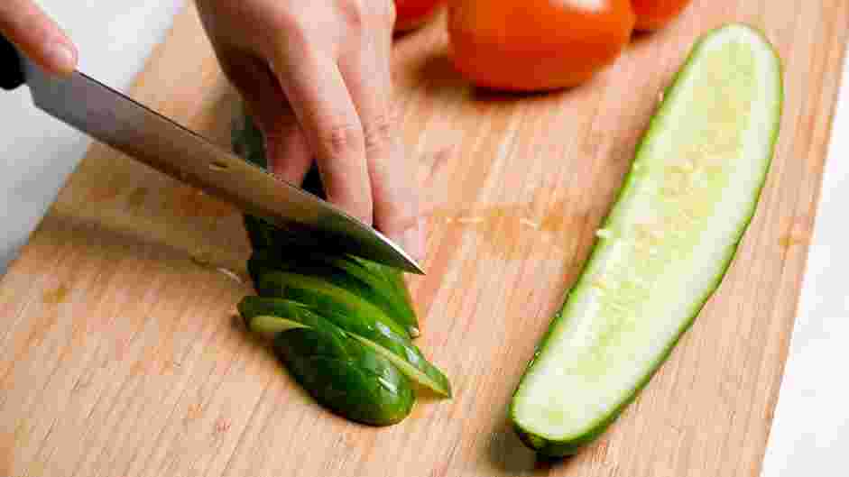 Cucumber Tomato Feta Salad Recipe: Cut cucumber in half lengthwise and then slice on a bias.