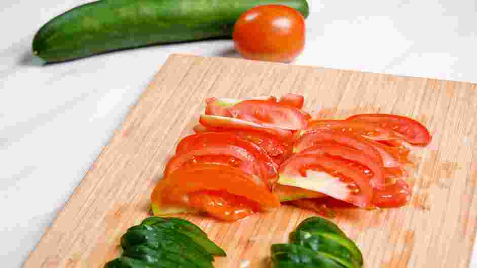 Cucumber Tomato Feta Salad Recipe: If using Roma tomatoes, cut down the center and slice.