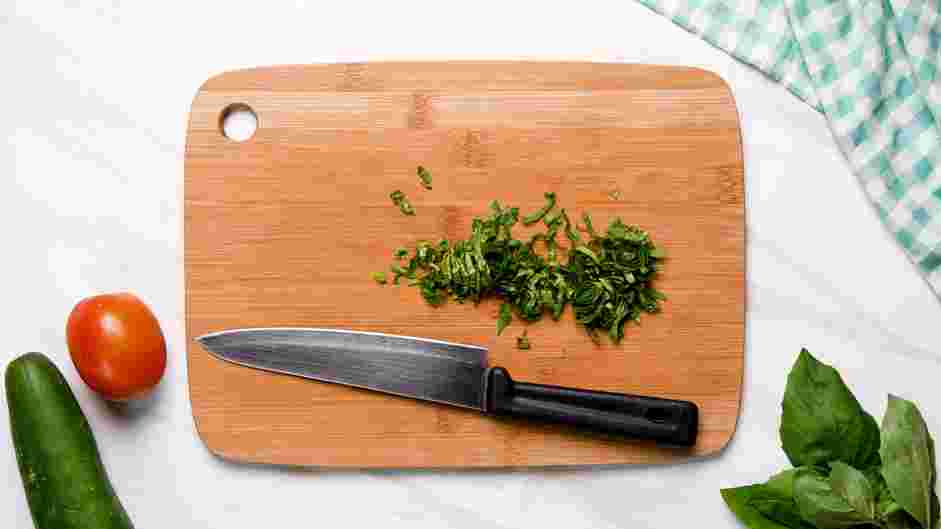 Cucumber Tomato Feta Salad Recipe: Cut the basil into ribbons (chiffonade).